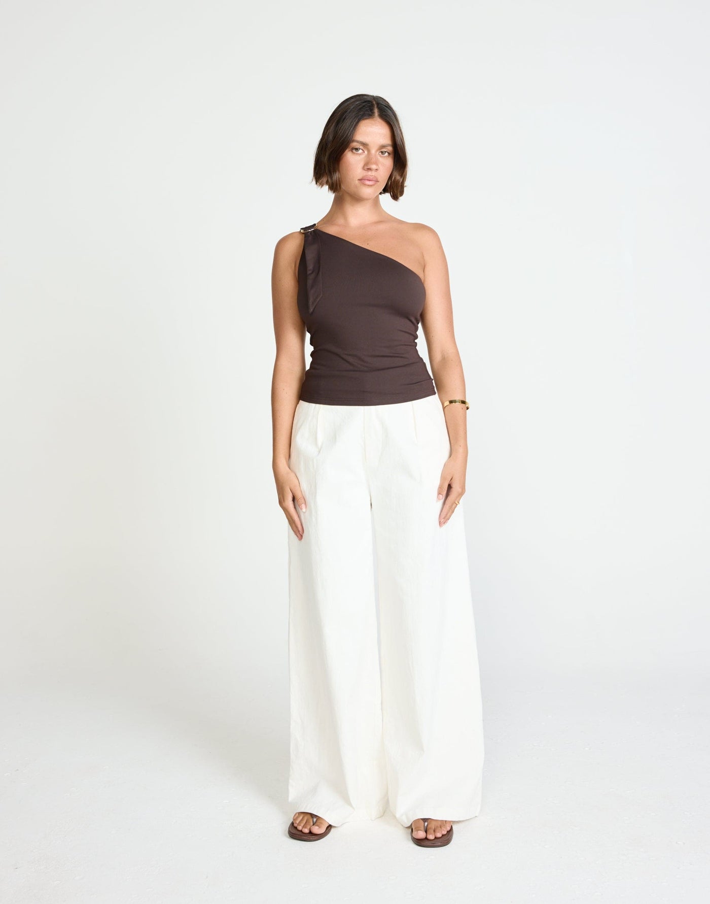 Zuelia Top (Chocolate) | CHARCOAL Exclusive - Asymmetrical Neckline Top with Gold Embellishment - Women's Top - Charcoal Clothing