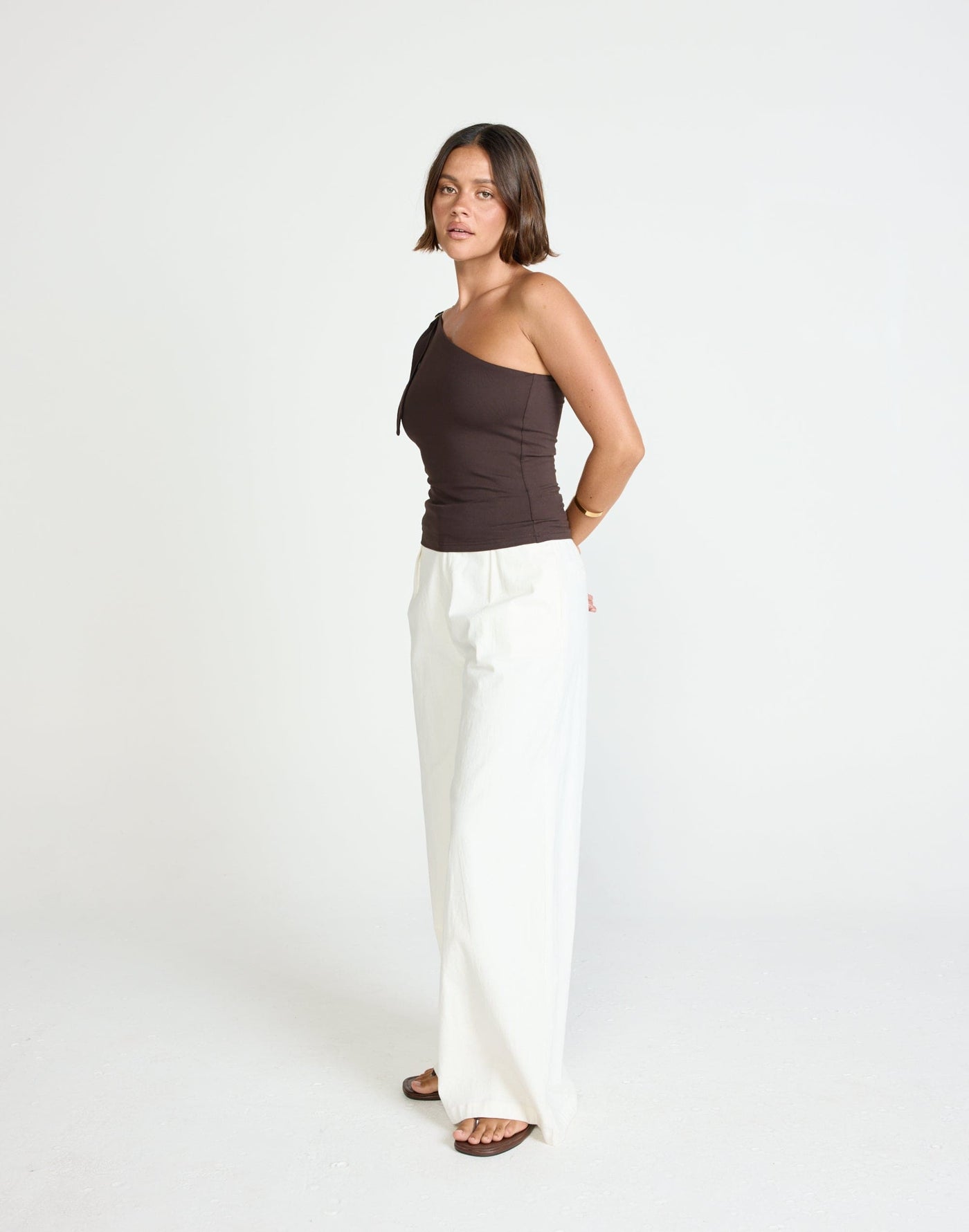 Zuelia Top (Chocolate) | CHARCOAL Exclusive - Asymmetrical Neckline Top with Gold Embellishment - Women's Top - Charcoal Clothing