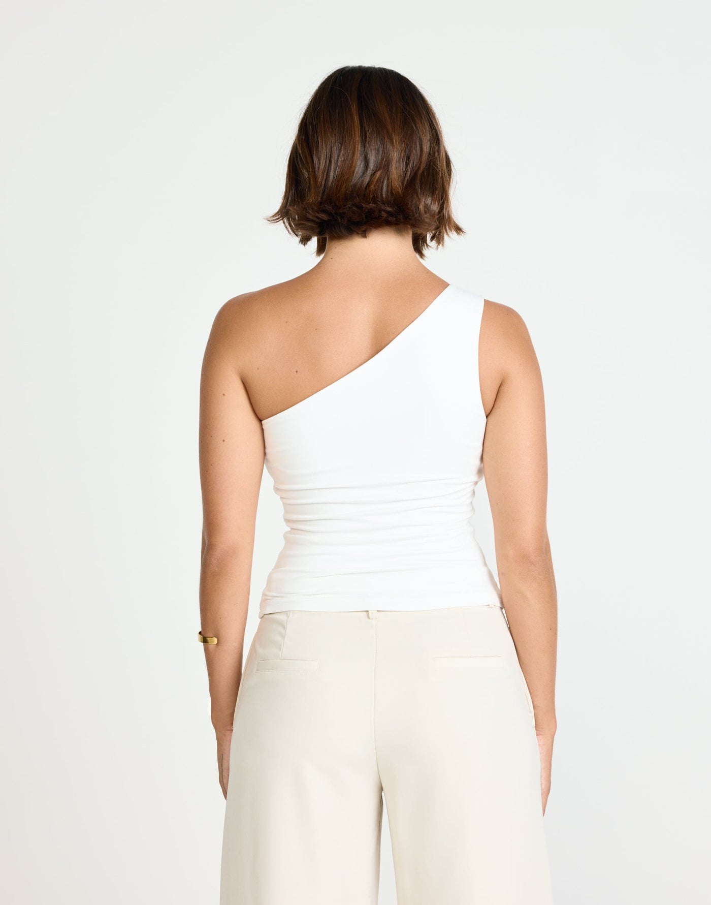 Zuelia Top (White) | CHARCOAL Exclusive - Asymmetrical Neckline Top with Gold Embellishment - Women's Top - Charcoal Clothing